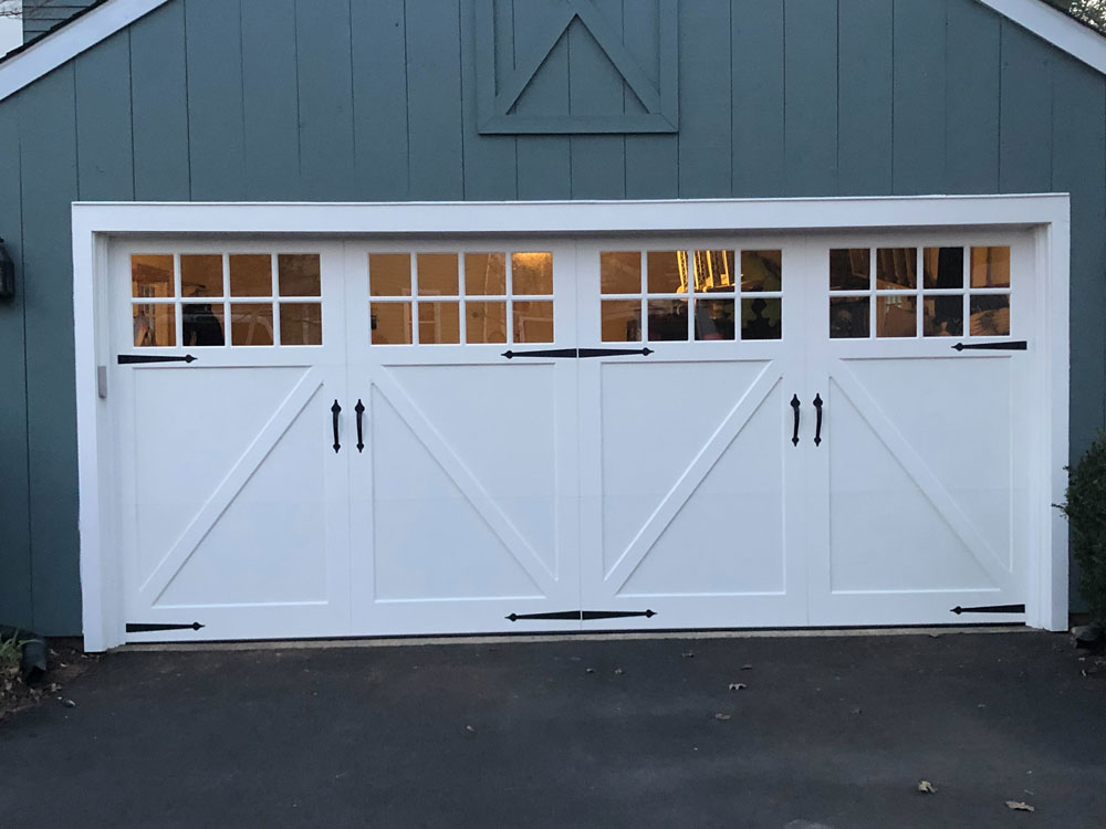 Blue House White Garage Doors